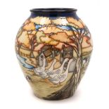 A Moorcroft pottery vase: of oviform tubelined in the Fowlers Patch pattern after the original by