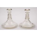 A pair of ship's decanters: of traditional blown form with quadruple neck rings and simple mushroom