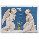 A Della Robbia type rectangular pottery plaque: of the Annunciation with the seated figure of Mary,