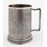 A 19th century Indian silver mug: of conical shape with all-over designs of botehs and flowerheads,