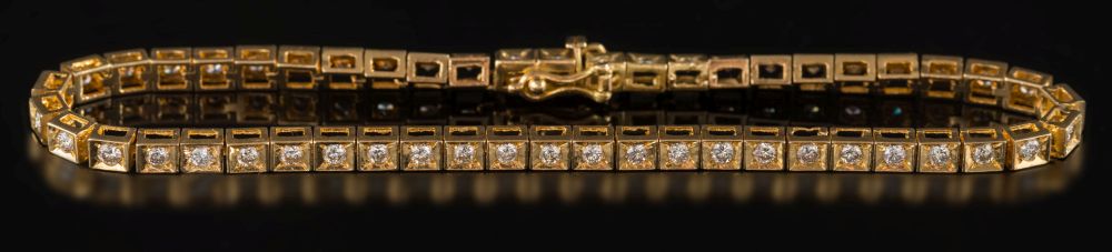 An 18ct yellow gold and diamond bracelet: with circular,
