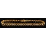 An 18ct yellow gold and diamond bracelet: with circular,