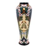 A Moorcroft pottery vase: of slender baluster form tubelined in the Avon Water pattern after an