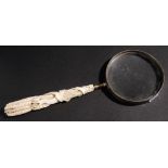 A 19th century magnifying glass: the ivory handle carved in the form of a wheatsheaf, 29cm.long.