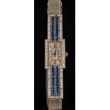 A lady's sapphire and diamond cocktail wristwatch: the rectangular dial on a bracelet with