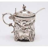 A Victorian silver lidded mustard pot, makers mark rubbed, London, 1878: crested,
