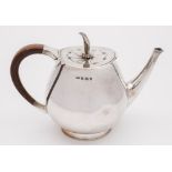An Elizabeth II silver teapot, maker RW, Birmingham, 1960: of ovoid form, on a circular foot, 25.