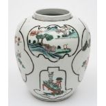 A Chinese famille verte oviform jar: painted with black line foliate shaped panels containing lake