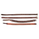Three leather cartridge belts and a canvas cartridge belt:.