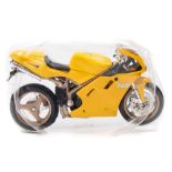 Maisto, a collection of diecast motorbikes: contained in bubble packs with plastic stands.