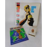 A 1966 World Cup programme: a World Cup 1966 33rpm record and a World Cup Willie money box.
