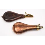 A leather and brass shot flask with embossed game decoration and a copper and brass powder flask:,
