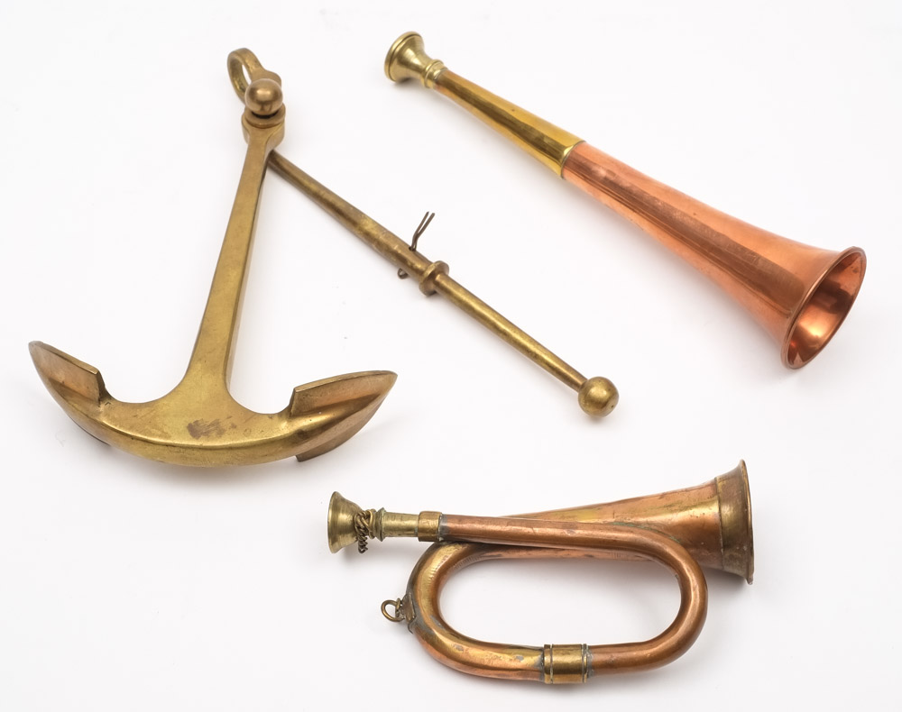 A small copper bugle,together with a copper and brass hunting horn and brass model of an anchor:,