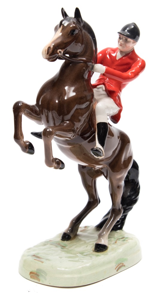 A Beswick model of Huntsman on a rearing horse, model 858, in brown gloss finish, 24cm high.