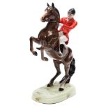A Beswick model of Huntsman on a rearing horse, model 858, in brown gloss finish, 24cm high.