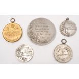 Three Edwardian running medallions to H M Haslehurst, together with two later sporting medallions:,