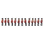 A set of thirteen marching Guardsmen:, unsigned, in an associated Britains Infantry box.