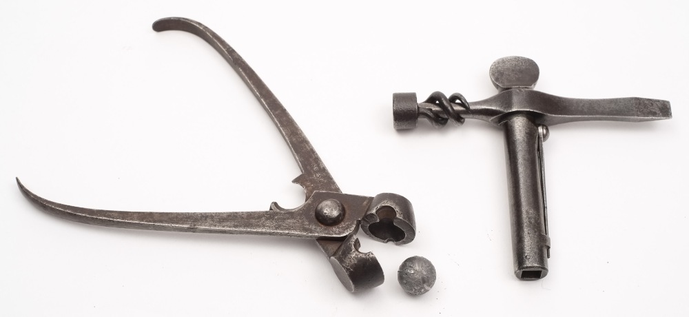 An Enfield T- shaped combination tool:, stamped with crown and numbered 30 to top,