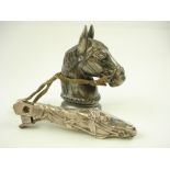 A Continental silver plated table lighter in the form of a horse's head,