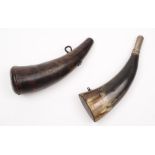 An early 19th century powder horn:, of plain form with single iron suspension and wooden bung,