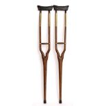 A pair of 19th century teak and brass mounted auxillary crutches:,