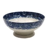 A late 18th century blue and white pearlware pedestal bowl: printed with a man o'war and inscribed