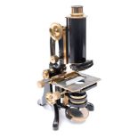 A lacquered brass microscope by C Baker, London:,