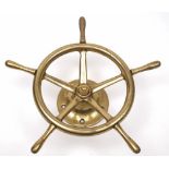 A small brass ship's helm:, on a brass mount, 39cm diameter.