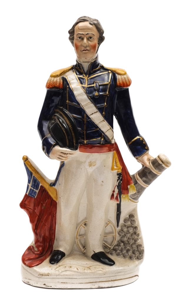 A Staffordshire pottery portrait figure of Admiral Sir Deans Dundas: modelled standing in naval