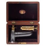 A brass and glass expressing pump by Millikin & Lawley, London:,