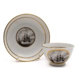 An early 19th century Newhall type porcelain teabowl and saucer with maritime decoration:,