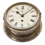 A brass cased circular bulkhead clock:, unsigned,