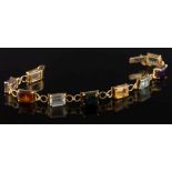 A multi-coloured gem-set bracelet: with nine rectangular gemstones in four-claw settings,