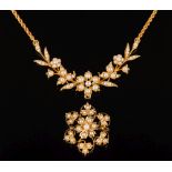A Victorian gold and seed pearl necklace: of openwork foliate design in fitted case with a similar