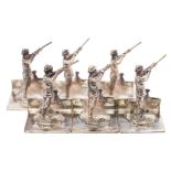 A set of six Elizabeth II silver novelty menu stands, maker A J Poole, Birmingham,