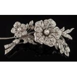 A white metal and diamond tremblant floral spray brooch: with graduated old-cut diamonds,