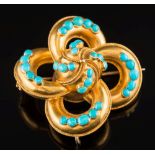 A 19th century gold and turquoise brooch: with 32 graduated turquoise, approximately 44mm across,