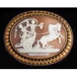 A late 19th century oval shell cameo brooch: depicting two classical female figures in a horse