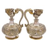 A pair of 19th century French silver-gilt ewers: of baluster form,