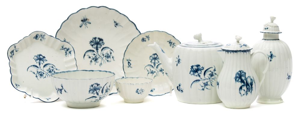 A First Period Worcester porcelain part tea service: of lobed form painted in blue in the