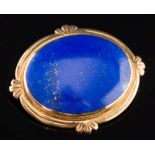 An oval lapis lazuli single stone brooch:, 44mm total length, 15gms gross weight.