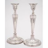 A pair of William IV silver candlesticks, all marks worn, maker possibly Samuel Roberts & Co,