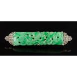 A jade and diamond bar brooch: set with a pierced carved jade panel between millegrain set diamond