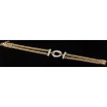 An 18ct gold and diamond flat curb-link two strand bracelet: pave-set with twenty four circular,