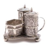 A Chinese silver three-piece cruet, maker WS possibly Woshing, Shanghai: on trefoil stand,