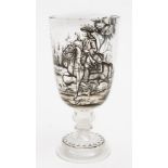 A German 'Historismus' glass goblet: enamelled in black monochrome with a continuous hunting scene,