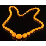 A graduated amber bead single-string necklace:,