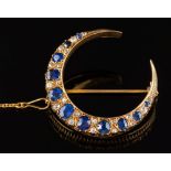 A late 19th century gold, sapphire and diamond crescent brooch: with graduated,