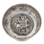 A Greek/Ottoman silver dish: of shallow circular form with central raised boss repousse decorated