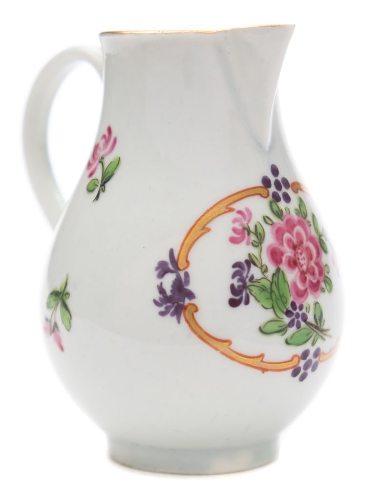 A First Period Worcester sparrow beak cream jug: of baluster form with grooved loop handle,